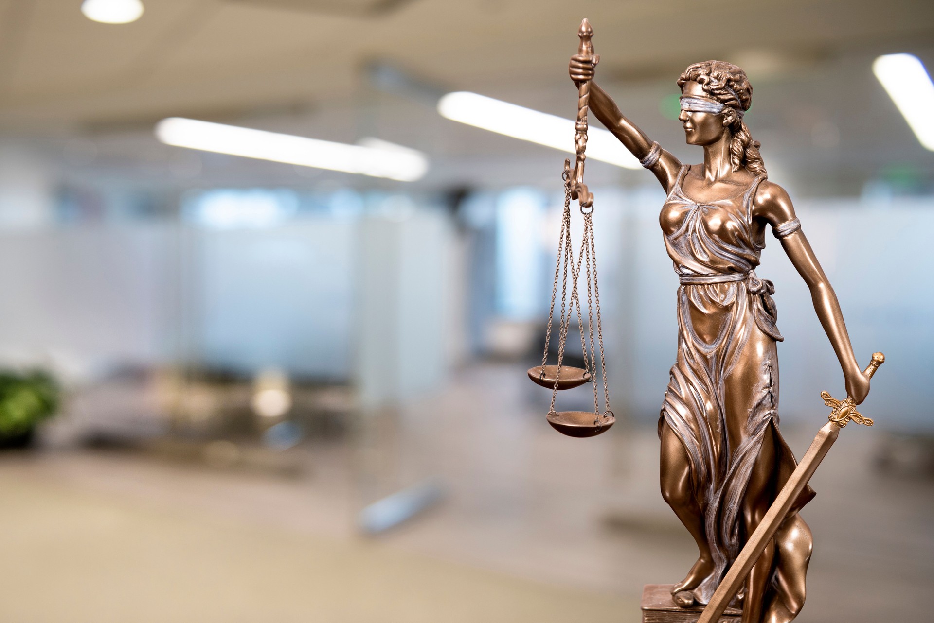 Lady Justice Statue with Defocused Office Background