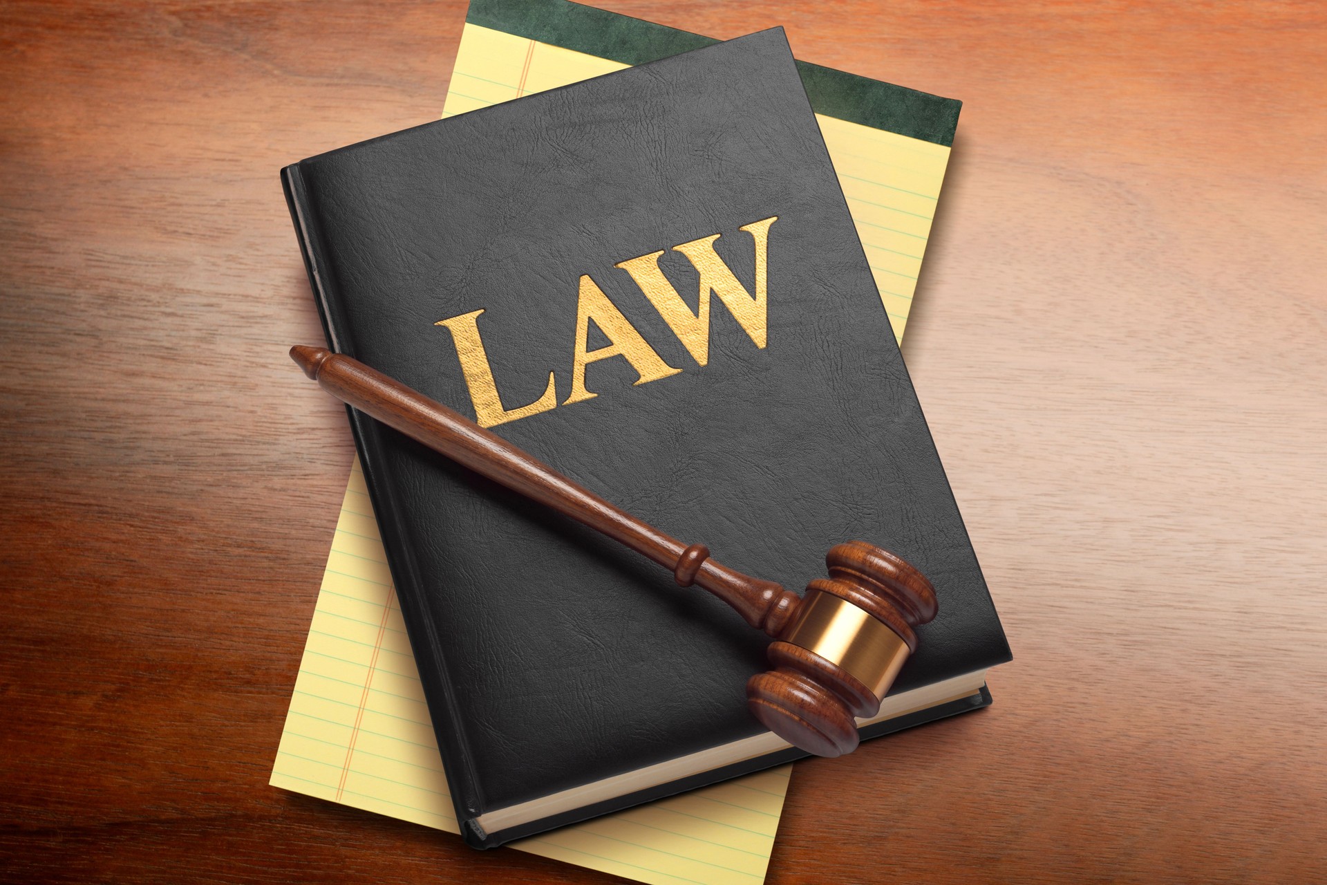 Gavel Resting On Top Of A Law Book on A Desk